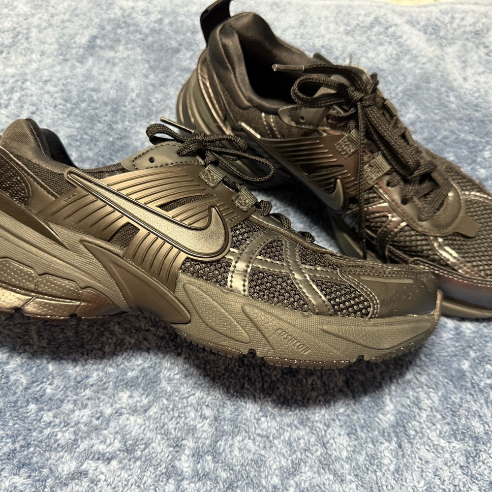 Nike Black Sneakers with Durable Mesh and Traction Tread